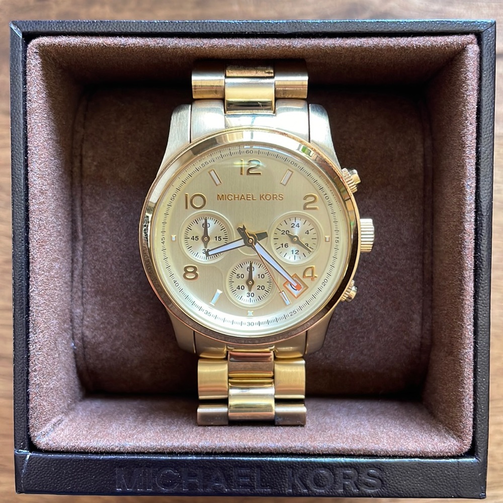 Gold Michael Kors Watch in like new condition with box, links, tag and manual